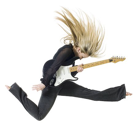 simsearch:640-01363127,k - Profile of woman jumping with electric guitar Fotografie stock - Premium Royalty-Free, Codice: 640-02765143