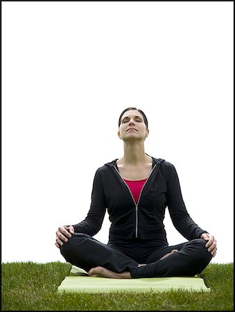 Femme faisant du yoga sur tapis de gazon Photographie de stock - Premium Libres de Droits, Code: 640-02765210