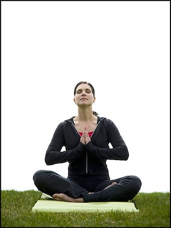 Femme faisant du yoga sur tapis de gazon Photographie de stock - Premium Libres de Droits, Code: 640-02765211