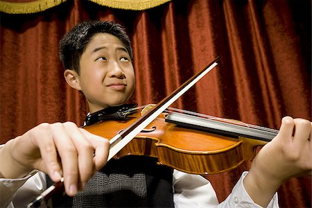 picture of young boy holding violin - Boy playing violin Stock Photo - Premium Royalty-Free, Code: 640-02765249