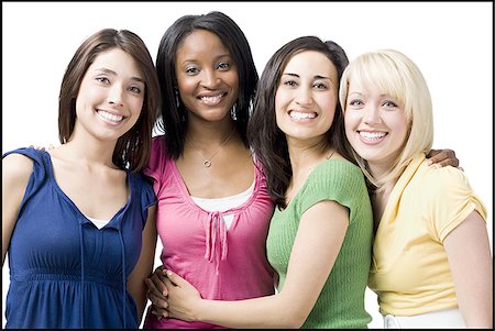 Four women hugging and smiling Stock Photo - Premium Royalty-Free, Code: 640-02765283
