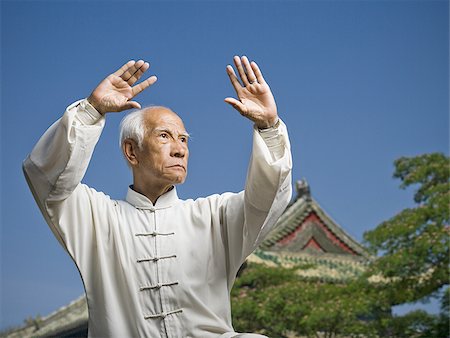 Man doing Kung Fu outdoors Stock Photo - Premium Royalty-Free, Code: 640-02765335