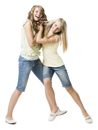 friends fighting not talking - Deux filles jouent au combat et souriant Photographie de stock - Premium Libres de Droits, Code: 640-02765367