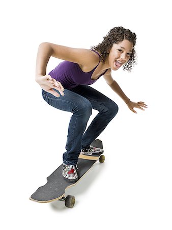 simsearch:640-01353029,k - Fille avec accolades sur skateboard souriant Photographie de stock - Premium Libres de Droits, Code: 640-02765360