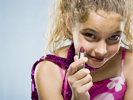 Girl with lipstick smiling Stock Photo - Premium Royalty-Free, Code: 640-02765383