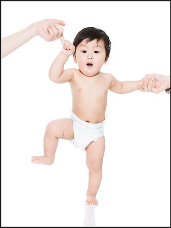baby's first steps Stock Photo - Premium Royalty-Free, Code: 640-02765614