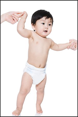 baby's first steps Stock Photo - Premium Royalty-Free, Code: 640-02765615