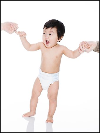 baby's first steps Stock Photo - Premium Royalty-Free, Code: 640-02765613