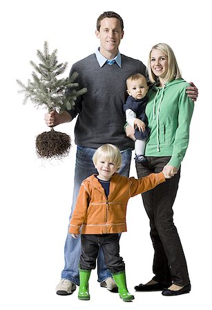 family with a pine tree Stock Photo - Premium Royalty-Free, Code: 640-02765622