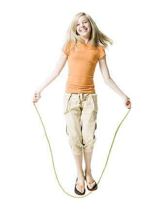 skipping ropes - Portrait of a girl jumping rope Stock Photo - Premium Royalty-Free, Code: 640-02765932
