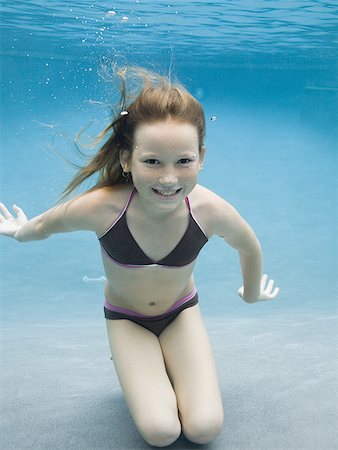 simsearch:640-02764438,k - Portrait of a girl swimming underwater Stock Photo - Premium Royalty-Free, Code: 640-02765972