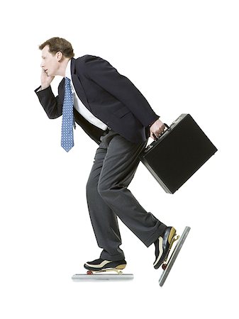 simsearch:640-02950930,k - Profile of a businessman ice-skating Stock Photo - Premium Royalty-Free, Code: 640-02766082