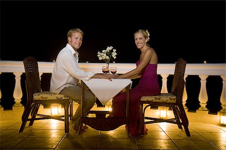 flowers and night table - Profile of a man and woman dining on the balcony Stock Photo - Premium Royalty-Free, Code: 640-02766493