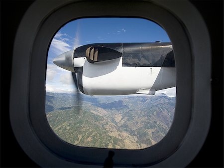 Looking out the window of an airplane Stock Photo - Premium Royalty-Free, Code: 640-02766509