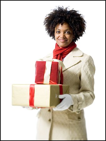 simsearch:640-02778481,k - Portrait d'une jeune femme tenant des coffrets cadeaux Photographie de stock - Premium Libres de Droits, Code: 640-02766614