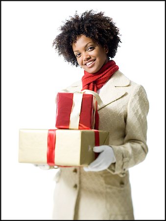 simsearch:640-02778481,k - Portrait d'une jeune femme tenant des coffrets cadeaux Photographie de stock - Premium Libres de Droits, Code: 640-02766615