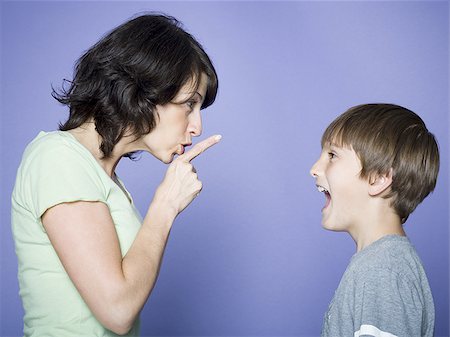 scolding - Profile of a mother scolding her son Foto de stock - Sin royalties Premium, Código: 640-02766625