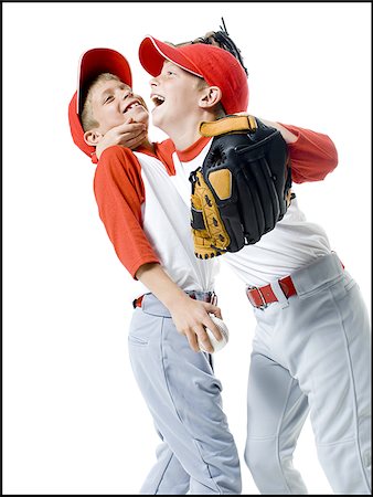 Close-up of two baseball players smiling Stock Photo - Premium Royalty-Free, Code: 640-02766638