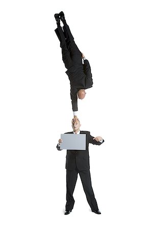 simsearch:640-01359466,k - Two male acrobats in business suits performing Stock Photo - Premium Royalty-Free, Code: 640-02766655