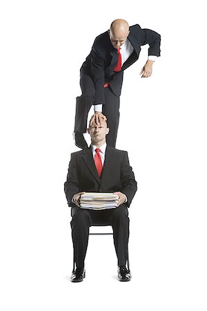 simsearch:640-02764552,k - Two male acrobats in business suits performing Foto de stock - Royalty Free Premium, Número: 640-02766657