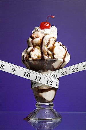 simsearch:640-01355019,k - Close-up of a tape measure around an ice-cream Stock Photo - Premium Royalty-Free, Code: 640-02766788
