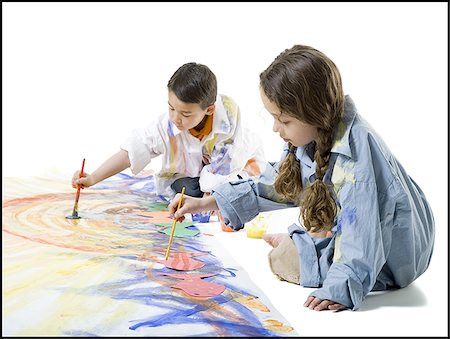 Girl and her brother painting on the floor Stock Photo - Premium Royalty-Free, Code: 640-02766803