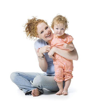 Portrait of a young woman and her daughter smiling Stock Photo - Premium Royalty-Free, Code: 640-02766940