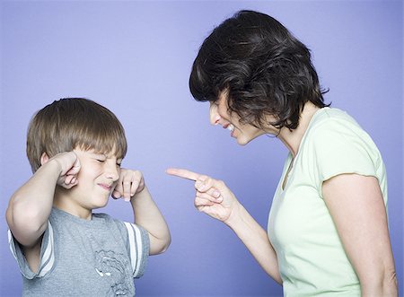 scolding - Close-up of a mid adult woman scolding her son Foto de stock - Sin royalties Premium, Código: 640-02766967