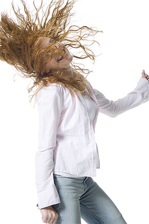 simsearch:640-02767900,k - Close-up of a young woman standing with her arms outstretched Stock Photo - Premium Royalty-Free, Code: 640-02766961