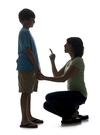parents reprimanding children - Close-up of a mid adult woman scolding her son Stock Photo - Premium Royalty-Free, Code: 640-02766985