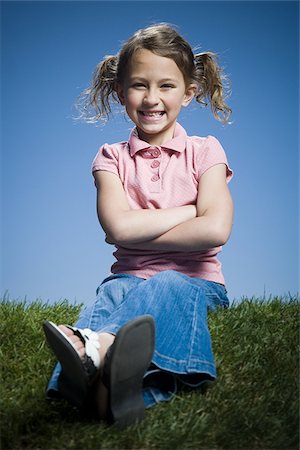 simsearch:640-02766847,k - Portrait of a girl sitting with her arms crossed Stock Photo - Premium Royalty-Free, Code: 640-02767004