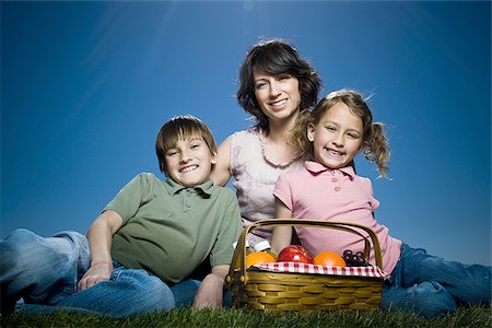 Portrait of a mid adult woman sitting with her son and daughter Stock Photo - Premium Royalty-Free, Code: 640-02767008