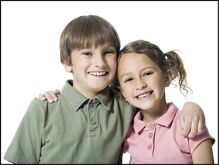 polo shirt silhouette - Portrait of a boy and his sister smiling Stock Photo - Premium Royalty-Free, Code: 640-02767002