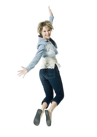 slippers women - Portrait of a young woman jumping in mid air Stock Photo - Premium Royalty-Free, Code: 640-02767024