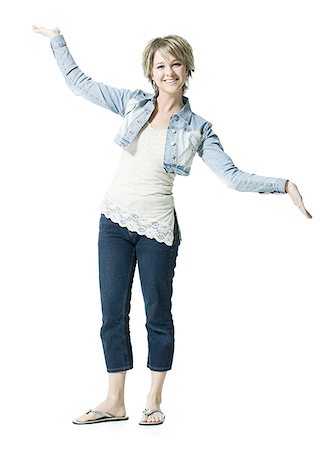 slippers women - Portrait of a young woman standing and smiling Stock Photo - Premium Royalty-Free, Code: 640-02767022