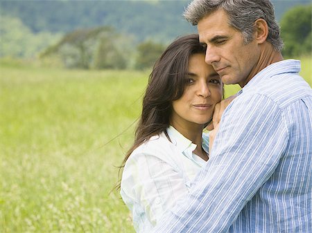 simsearch:640-01356469,k - Close-up of a man and a woman embracing in a field Stock Photo - Premium Royalty-Free, Code: 640-02767150