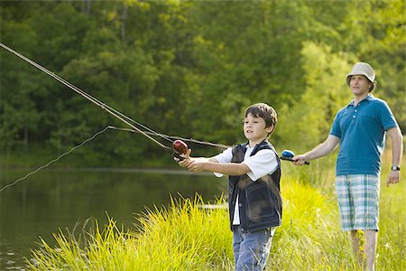 fishing fashion - Profile of a man and his son fishing Stock Photo - Premium Royalty-Free, Code: 640-02767349