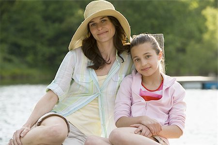 Portrait of a woman and her daughter smiling Stock Photo - Premium Royalty-Free, Code: 640-02767366