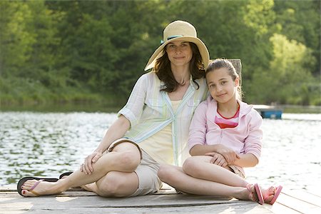Portrait of a woman and her daughter smiling Stock Photo - Premium Royalty-Free, Code: 640-02767367