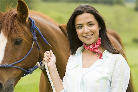 simsearch:640-02767509,k - Portrait of a woman holding the reins of a horse Foto de stock - Sin royalties Premium, Código: 640-02767467