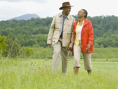 simsearch:640-02767411,k - Senior man and a senior woman walking in a field Stock Photo - Premium Royalty-Free, Code: 640-02767530