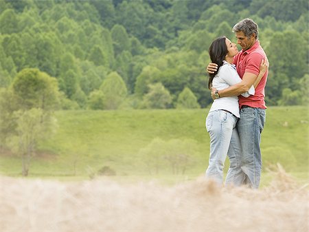 simsearch:640-03265364,k - Portrait of a man and a woman embracing each other Stock Photo - Premium Royalty-Free, Code: 640-02767541