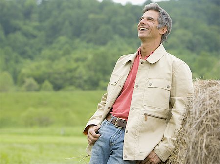 simsearch:700-03450838,k - Portrait of a man leaning against a hay bale Stock Photo - Premium Royalty-Free, Code: 640-02767567