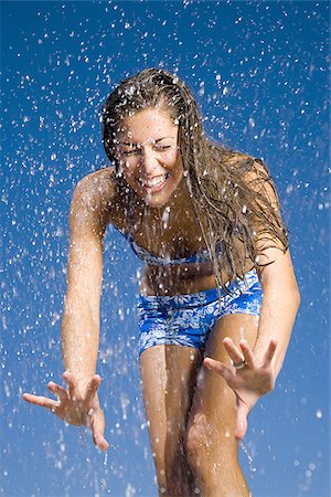 simsearch:640-01366031,k - Close-up of a young woman getting sprayed with water Foto de stock - Sin royalties Premium, Código: 640-02767662