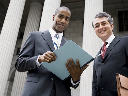 simsearch:640-01357639,k - Low angle view of two lawyers smiling Stock Photo - Premium Royalty-Free, Code: 640-02767799