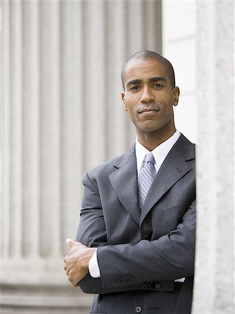 Portrait of a male lawyer standing with his arms folded Stock Photo - Premium Royalty-Free, Code: 640-02767829