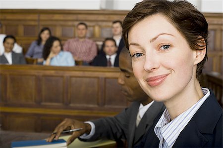Portrait of a female lawyer smiling Stock Photo - Premium Royalty-Free, Code: 640-02767861