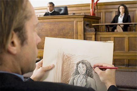 Close-up of a man drawing a sketch of a witness in a courtroom Stock Photo - Premium Royalty-Free, Code: 640-02767882