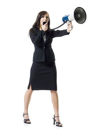 Close-up of a teenage girl holding a megaphone Stock Photo - Premium Royalty-Free, Code: 640-02768099