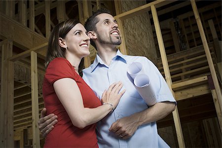 Low angle view of a young couple smiling Stock Photo - Premium Royalty-Free, Code: 640-02768138